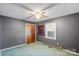 Spacious bedroom with ceiling fan and built-in shelving at 214 Costner Dr, Bessemer City, NC 28016