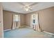 Bedroom with ceiling fan and two windows with curtains at 214 Costner Dr, Bessemer City, NC 28016