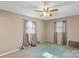 Bedroom with two windows, ceiling fan and teal carpeting at 214 Costner Dr, Bessemer City, NC 28016