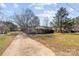 Ranch house with a long driveway and spacious yard at 214 Costner Dr, Bessemer City, NC 28016