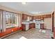 Bright kitchen with wood cabinets and white appliances at 214 Costner Dr, Bessemer City, NC 28016