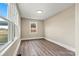 Bright bedroom with wood-look floors and large windows at 2829 1St Nw Ave, Hickory, NC 28601