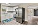 Modern kitchen featuring white cabinets, stainless steel appliances, and stylish herringbone backsplash at 2829 1St Nw Ave, Hickory, NC 28601