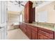 Bathroom featuring double vanity sinks, granite countertops, and a soaking tub at 2865 Scarborough Ct, Gastonia, NC 28054