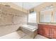 Stylish bathroom featuring tile floors, glass shower, soaking tub, and modern vanity at 2865 Scarborough Ct, Gastonia, NC 28054