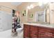 Bathroom features a double vanity with granite counters and a shower over tub with curtain at 2865 Scarborough Ct, Gastonia, NC 28054