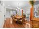 Elegant dining room with hardwood floors, chandelier, and large windows at 2865 Scarborough Ct, Gastonia, NC 28054