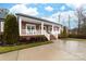 Inviting front porch featuring classic white railings and comfortable seating, perfect for enjoying serene outdoor moments at 2865 Scarborough Ct, Gastonia, NC 28054