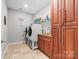 Laundry room with modern washer and dryer units and built-in storage at 2865 Scarborough Ct, Gastonia, NC 28054