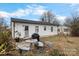 Cozy backyard features an outdoor table, grill, and an interesting bench/table design at 2907 1St Nw Ave, Hickory, NC 28601