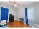 This bedroom offers natural light from the window, hardwood floors and an organized storage unit at 2907 1St Nw Ave, Hickory, NC 28601