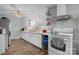 Functional kitchen with white cabinets, brick tile backsplash, and modern appliances at 2907 1St Nw Ave, Hickory, NC 28601