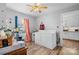 Well-lit laundry room with appliances and window, leading to the kitchen, offers functionality and convenience at 2907 1St Nw Ave, Hickory, NC 28601