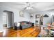 Cozy living room with wood floors, a ceiling fan, and an archway leading to the kitchen at 2907 1St Nw Ave, Hickory, NC 28601