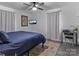 Cozy bedroom featuring a ceiling fan, and carpet, with a desk and chair at 3021 Botany St, Charlotte, NC 28216