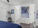 Bedroom with hardwood floors, adjacent laundry room, and a modern piece of wall art at 3021 Botany St, Charlotte, NC 28216