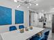 Dining room with modern chandelier and stylish seating, adjacent to a kitchen with white cabinets at 3021 Botany St, Charlotte, NC 28216