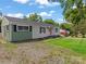 Charming single-story home with a well-maintained lawn and neutral siding, perfect for first-time buyers at 3021 Botany St, Charlotte, NC 28216