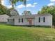 Charming single-story home with a well-maintained lawn and neutral siding, perfect for first-time buyers at 3021 Botany St, Charlotte, NC 28216