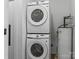 Efficient laundry area with stacked Samsung washer and dryer; convenient and space-saving at 3021 Botany St, Charlotte, NC 28216