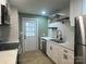 Modern kitchen featuring stainless steel appliances, floating shelves, and updated countertops at 3027 Remington St, Charlotte, NC 28216