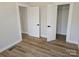 Well-lit bedroom with hardwood floors and double closets at 330 West Blvd, Charlotte, NC 28203