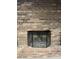 Brick fireplace with a metal screen at 3333 Audrey Dr, Gastonia, NC 28054