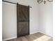 Rustic barn door adds character to the room at 344 Luther Scronce Rd, Vale, NC 28168