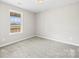 Bright bedroom with carpet and a window overlooking the yard at 344 Luther Scronce Rd, Vale, NC 28168