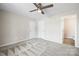 Spacious bedroom with carpet, ceiling fan, and access to bathroom at 344 Luther Scronce Rd, Vale, NC 28168