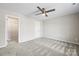 Bedroom with carpet, ceiling fan, and walk-in closet at 344 Luther Scronce Rd, Vale, NC 28168