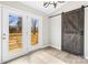 Dining area with sliding glass doors and barn door at 344 Luther Scronce Rd, Vale, NC 28168