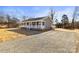 Gray ranch home with white porch and gravel driveway at 344 Luther Scronce Rd, Vale, NC 28168