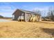 Ranch home with gray siding, front porch, and gravel driveway at 344 Luther Scronce Rd, Vale, NC 28168