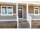 Front porch with white railings and brick steps at 344 Luther Scronce Rd, Vale, NC 28168