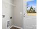 Bright laundry room with shelving and exterior access at 344 Luther Scronce Rd, Vale, NC 28168