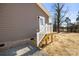 Exterior side view showing stairs and access door at 344 Luther Scronce Rd, Vale, NC 28168