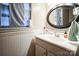 Bathroom with vanity and oval mirror at 400 Charles St, Spencer, NC 28159