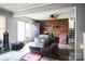 Living room with brick fireplace and lots of natural light at 400 Charles St, Spencer, NC 28159