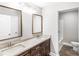 Double vanity bathroom with granite countertop and mirrors at 413 Peach St, Kannapolis, NC 28083