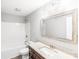 Bathroom features granite vanity, large mirror, and shower/tub combo at 413 Peach St, Kannapolis, NC 28083