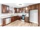 Modern kitchen with dark wood cabinets and stainless steel appliances at 413 Peach St, Kannapolis, NC 28083