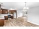 Open concept kitchen and living area with wood-look flooring at 413 Peach St, Kannapolis, NC 28083