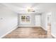 Spacious living room with neutral walls and wood-look flooring at 413 Peach St, Kannapolis, NC 28083