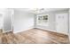 Living room featuring a large window and wood-look flooring at 413 Peach St, Kannapolis, NC 28083