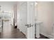 Small powder room with pedestal sink and white cabinets at 414 W Tremont Ave, Charlotte, NC 28203