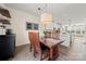 Bright dining area with hardwood floors and modern lighting at 414 W Tremont Ave, Charlotte, NC 28203