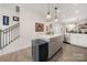 Spacious kitchen with gray island and white cabinets at 414 W Tremont Ave, Charlotte, NC 28203