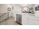 Modern kitchen with stainless steel appliances and white cabinets at 414 W Tremont Ave, Charlotte, NC 28203