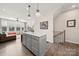 Open concept kitchen with white cabinets, an island, and modern lighting at 414 W Tremont Ave, Charlotte, NC 28203